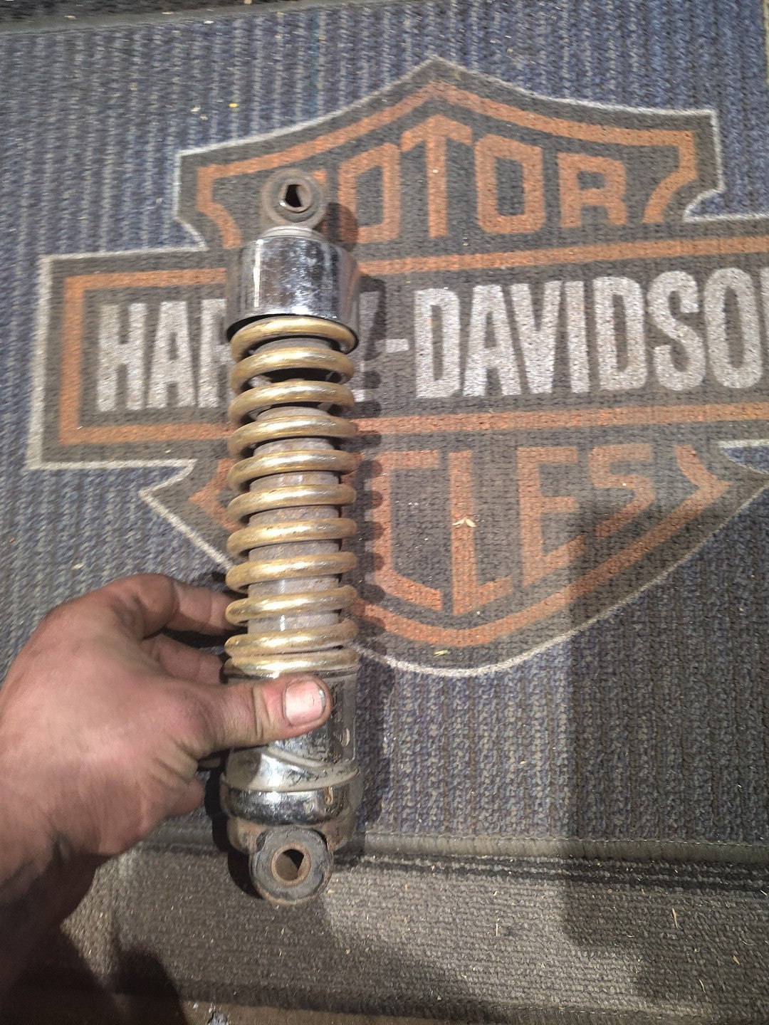 Gold Harley-Davidson Motorcycle Shock